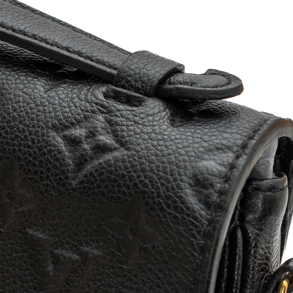 Métis Pochette bag in black imprint leather